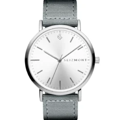 Moment | Srebrny minimalistyczny zegarek analogowy z mechanizmem kwarcowym, srebrną tarczą i ciemnoszarym nylonowym paskiem